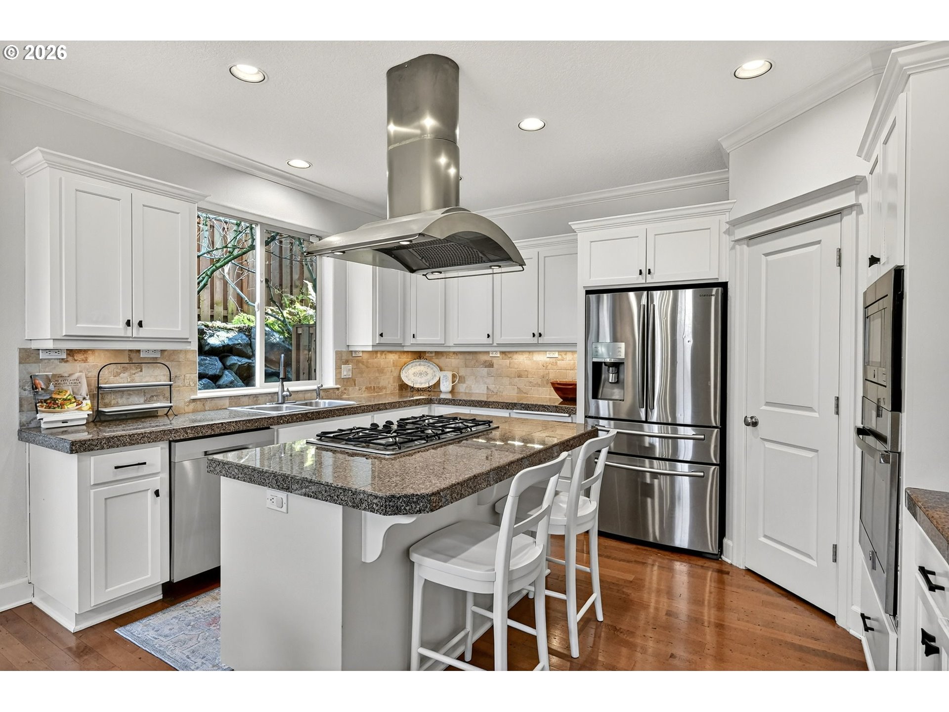 2064 Northwest Village Circle, Unit 44 Portland, OR 97229 - Photo 14 of 45 a kitchen with stainless steel appliances granite countertop a stove refrigerator sink and dishwasher with wooden floor