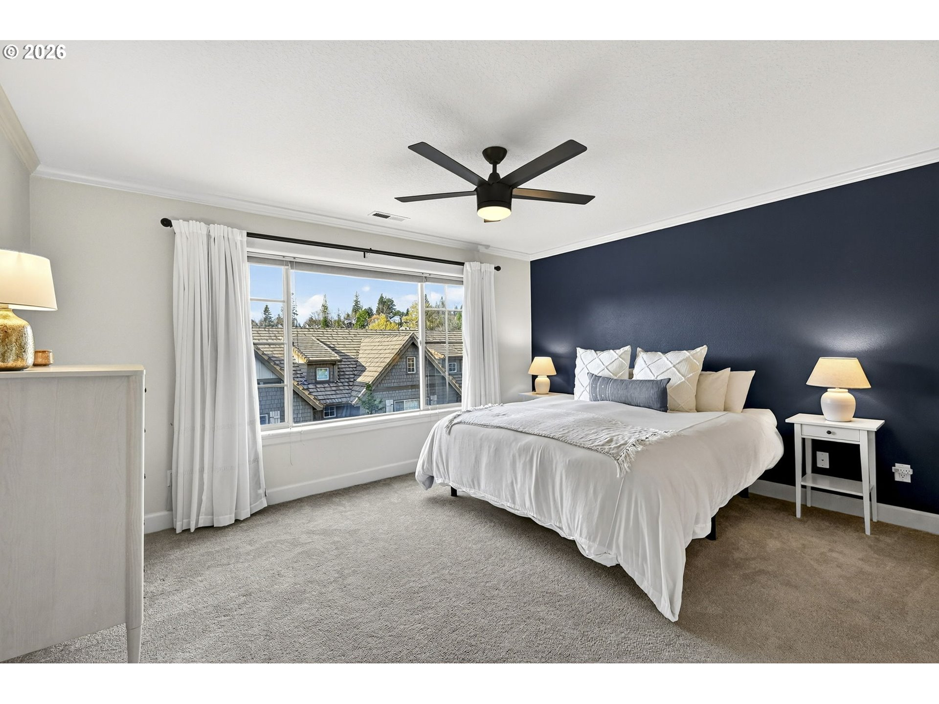 2064 Northwest Village Circle, Unit 44 Portland, OR 97229 - Photo 18 of 45 a bedroom with a large bed and a large window