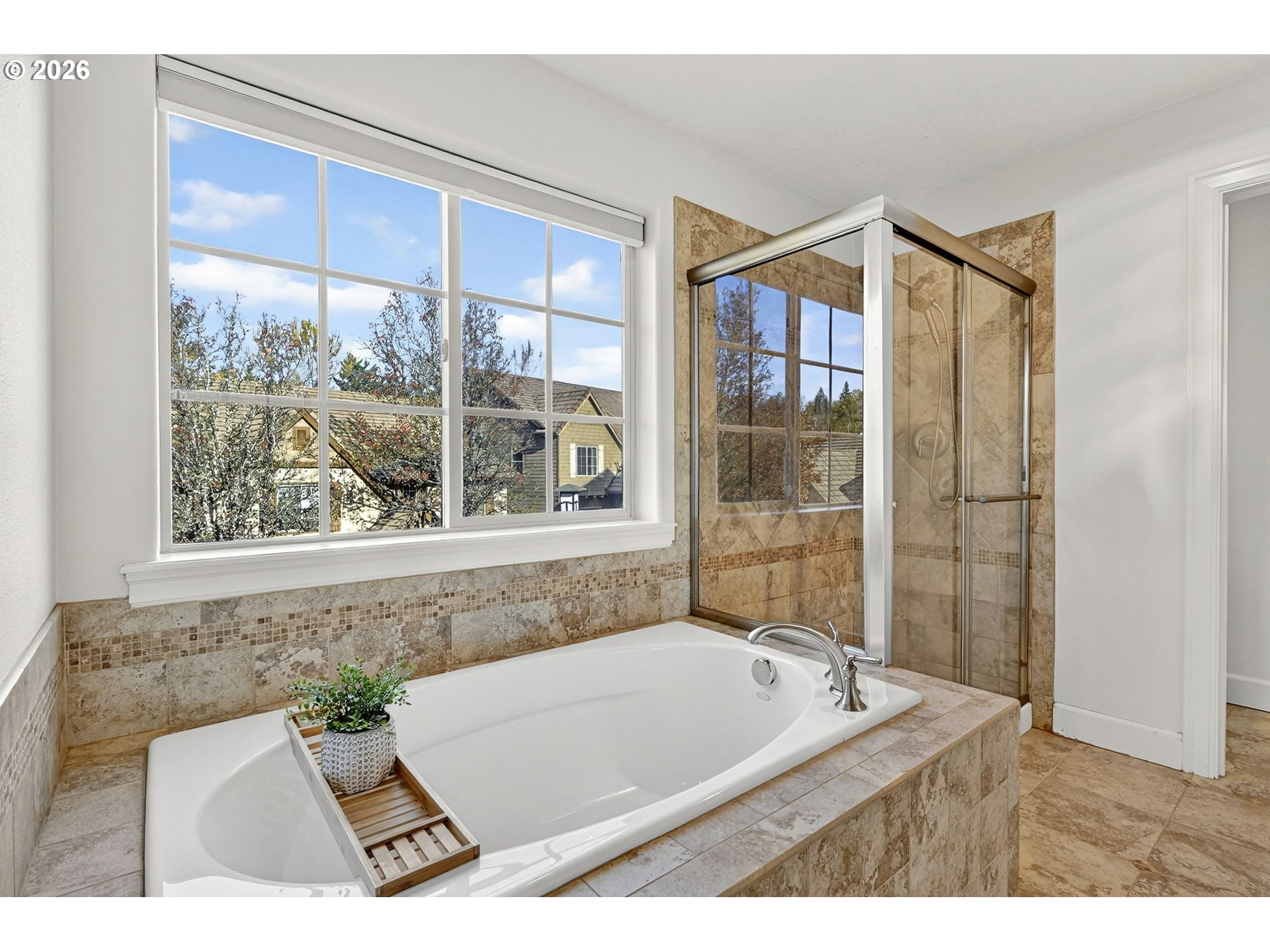 2064 Northwest Village Circle, Unit 44 Portland, OR 97229 - Photo 21 of 45 a bathroom with a bathtub and next to a window