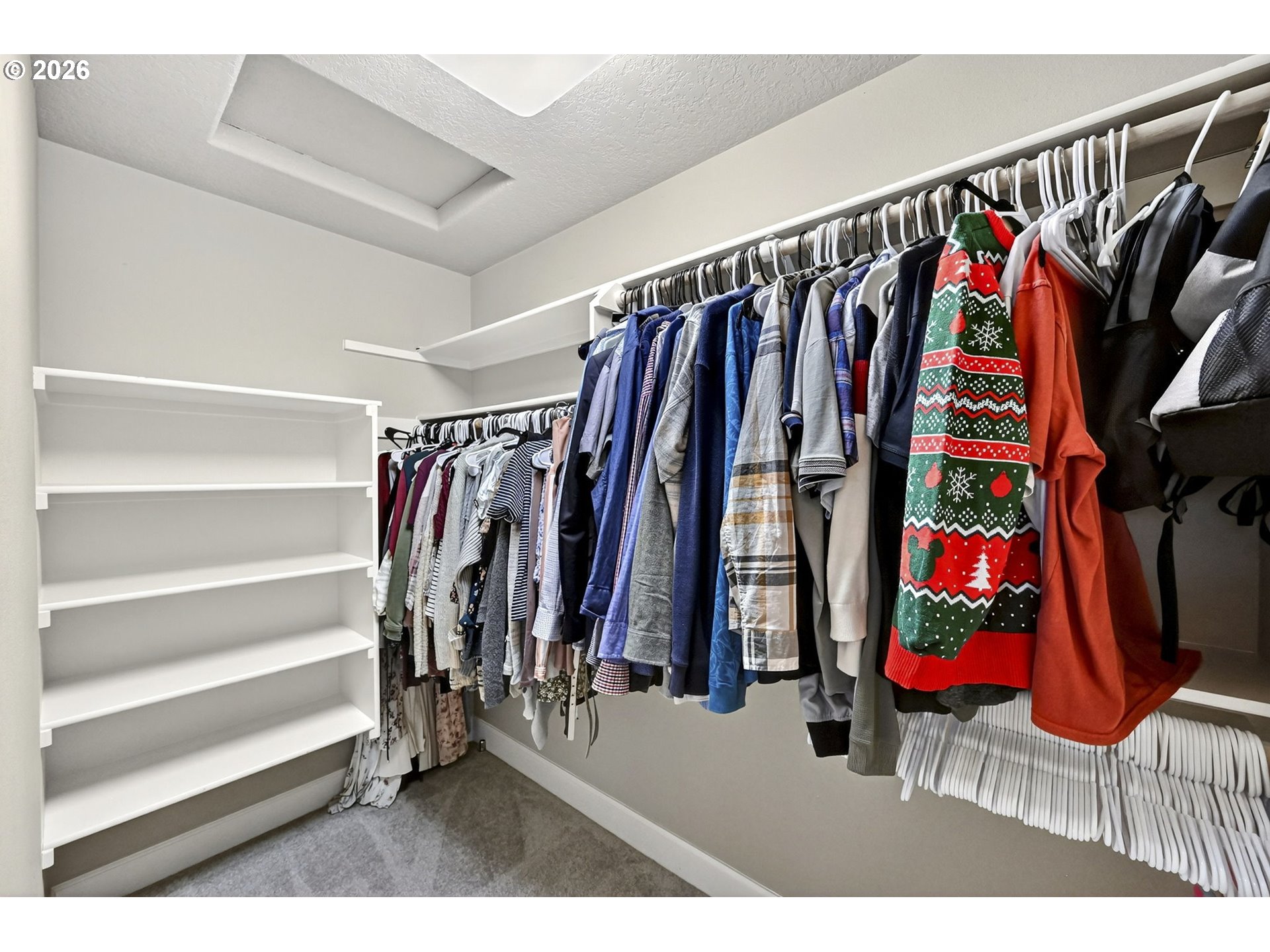 2064 Northwest Village Circle, Unit 44 Portland, OR 97229 - Photo 23 of 45 a view of walk in closet with clothes