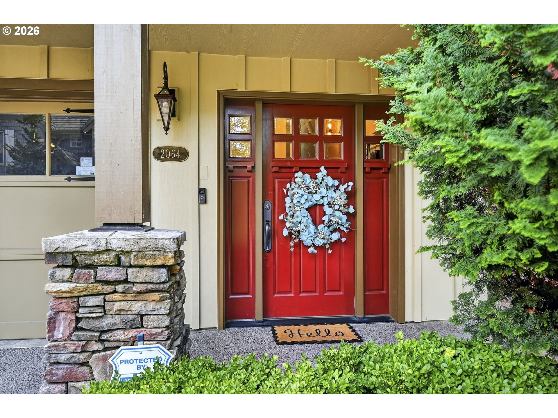 2064 Northwest Village Circle, Unit 44 Portland, OR 97229 - Photo 3 of 45 a front view of a house with a yard