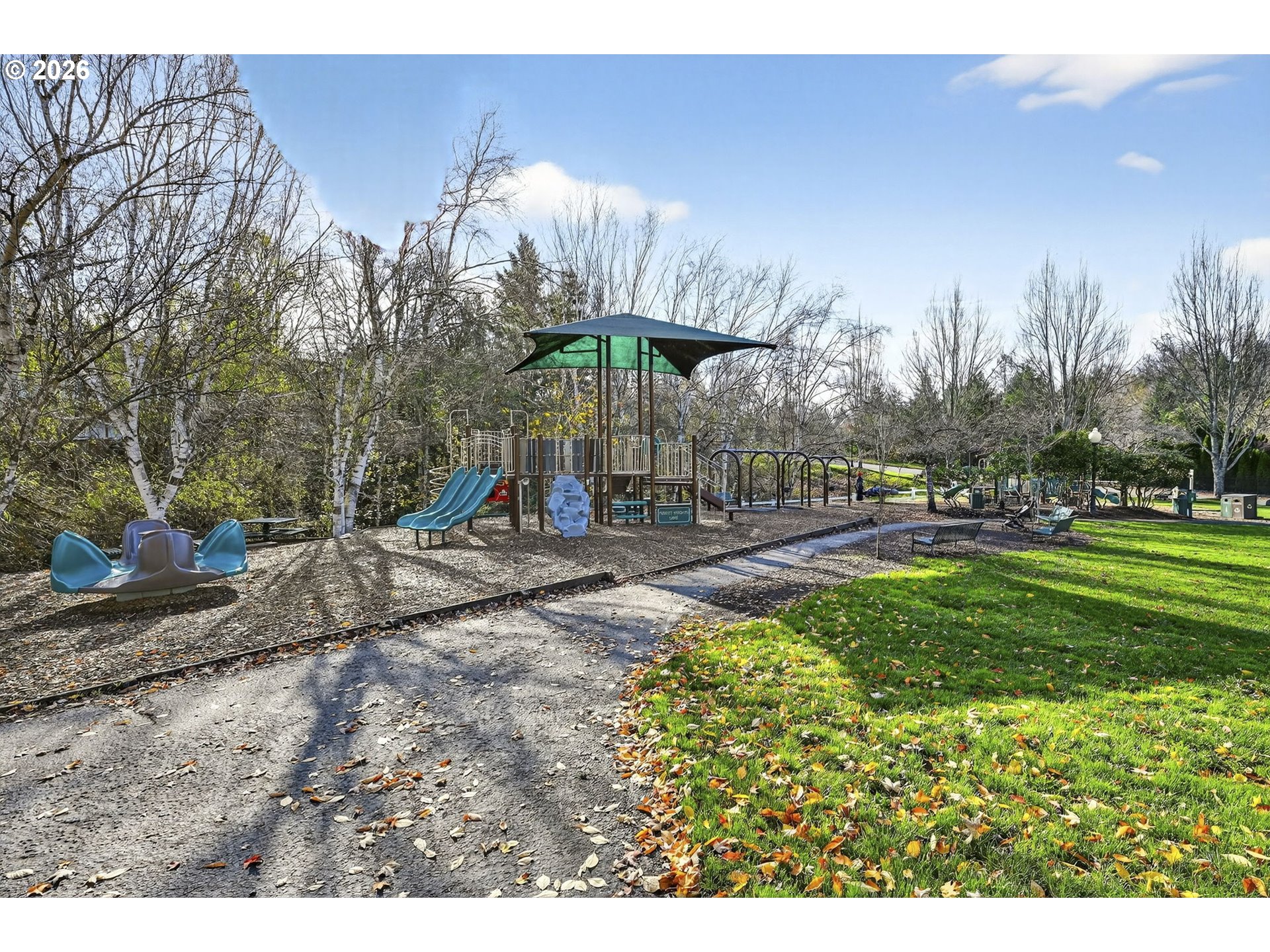 2064 Northwest Village Circle, Unit 44 Portland, OR 97229 - Photo 37 of 45 a childrens park with lots of swings and slides