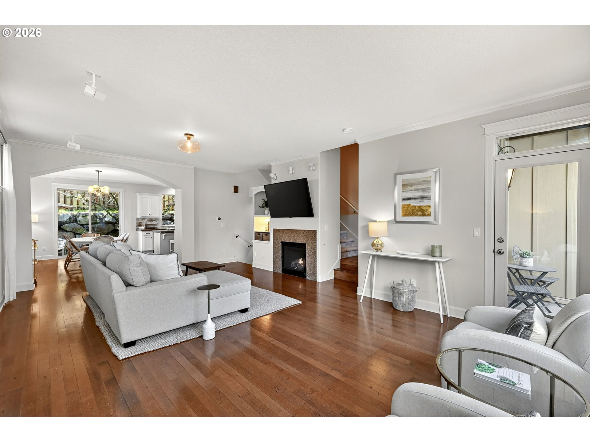 2064 Northwest Village Circle, Unit 44 Portland, OR 97229 - Photo 8 of 45 a living room with furniture flat screen tv and a fireplace
