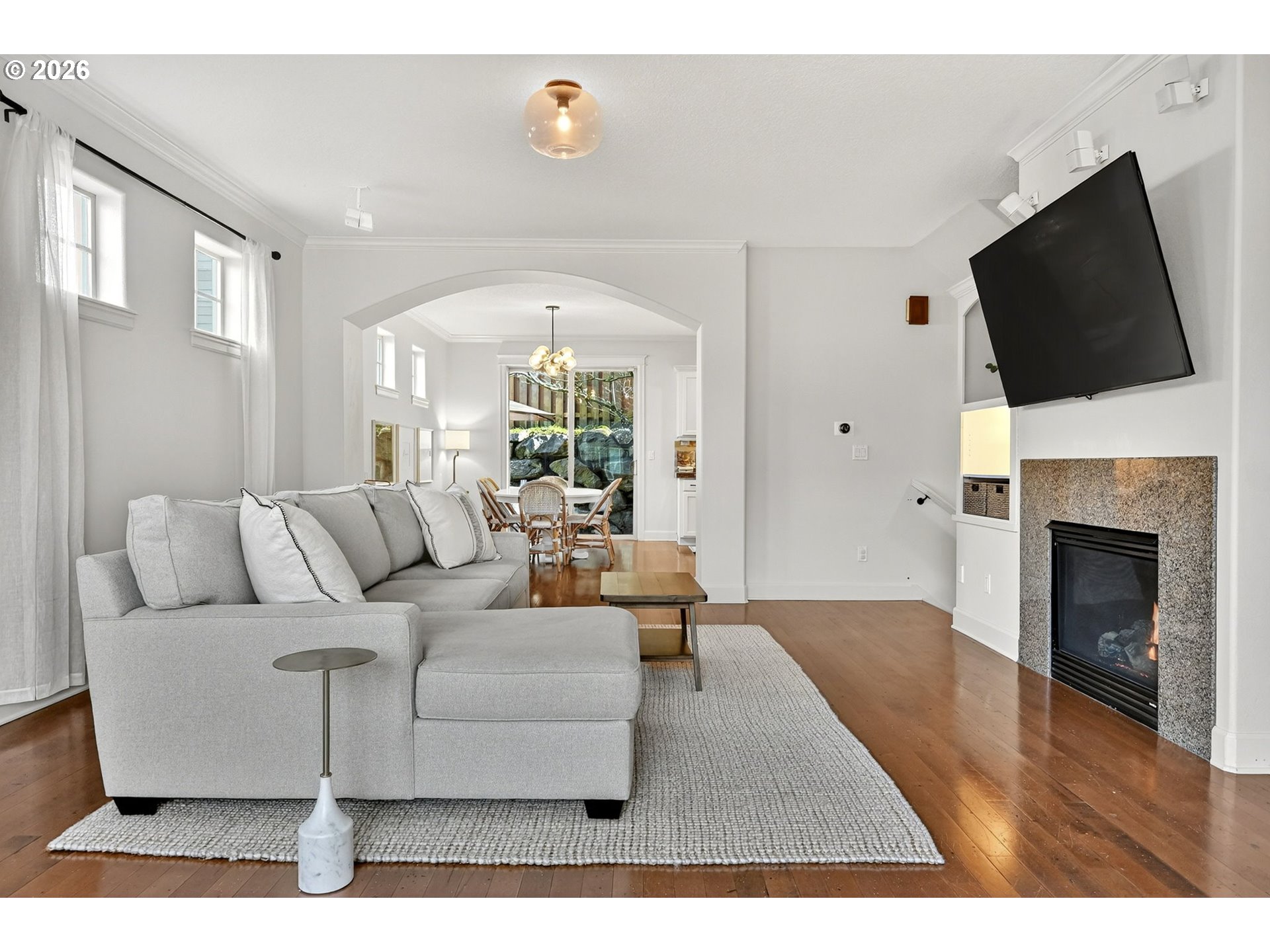 2064 Northwest Village Circle, Unit 44 Portland, OR 97229 - Photo 9 of 45 a living room with furniture fireplace and flat screen tv