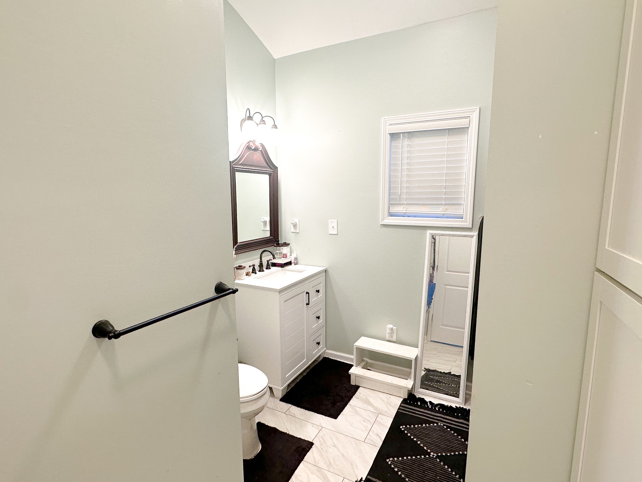 3820 Jefferson Road Smithville, TN 37166 - Photo 6 of 15 a bathroom with a toilet sink and mirror