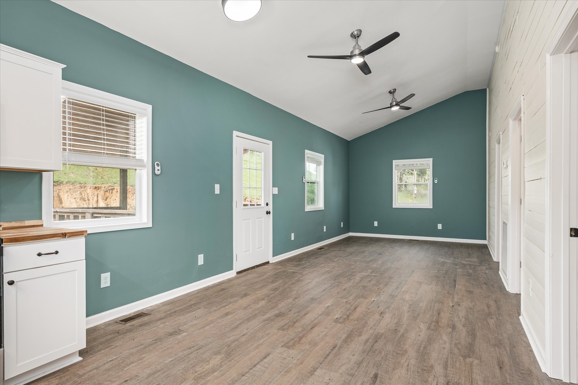 3820 Jefferson Road Smithville, TN 37166 - Photo 10 of 15 a view of an empty room with a window and wooden floor