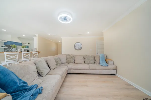 a living room with furniture and a couches