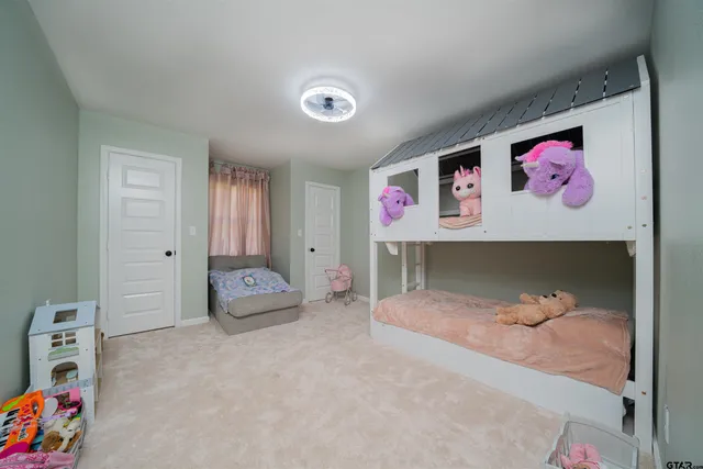 a bedroom with furniture and a bed