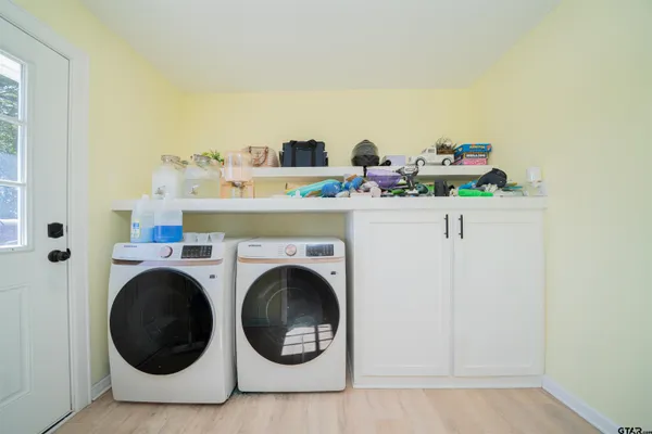 a utility room with dryer and washer