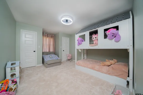 a bedroom with furniture and a bed