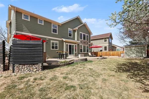 a view of house with yard