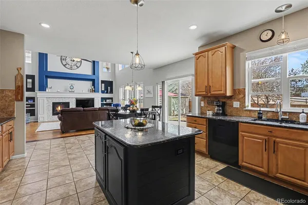a kitchen with stainless steel appliances a sink stove and cabinets