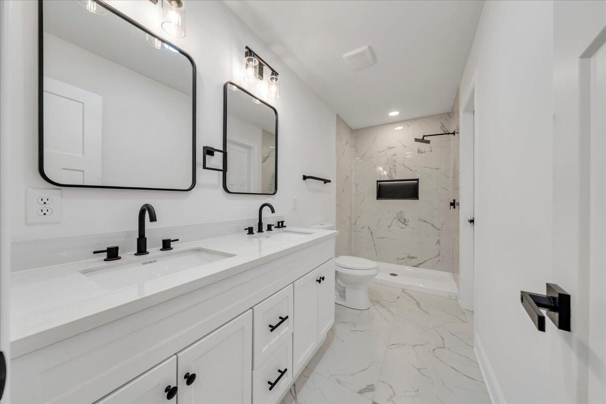 2365 Lakewood Forest Road Moneta, VA 24121 - Photo 22 of 90 a bathroom with a double vanity sink double and mirror