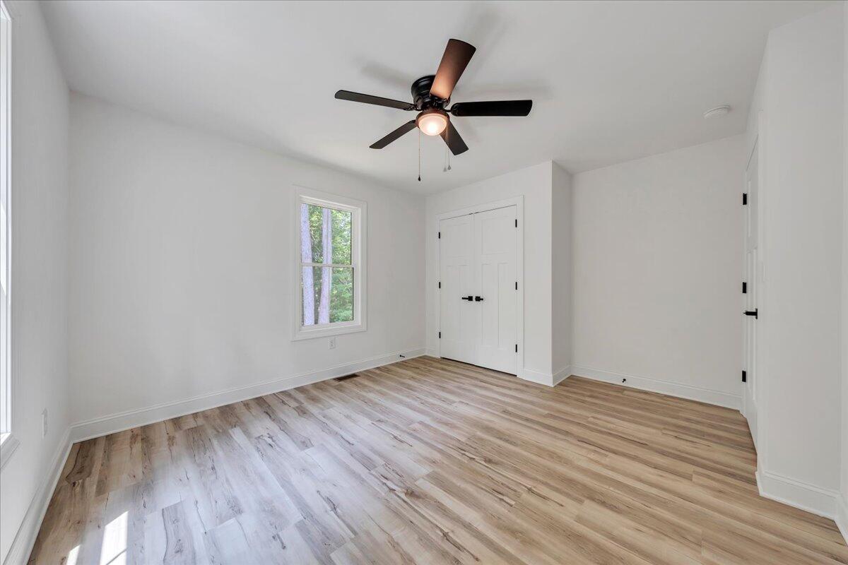 2365 Lakewood Forest Road Moneta, VA 24121 - Photo 26 of 90 a view of empty room with wooden floor and fan