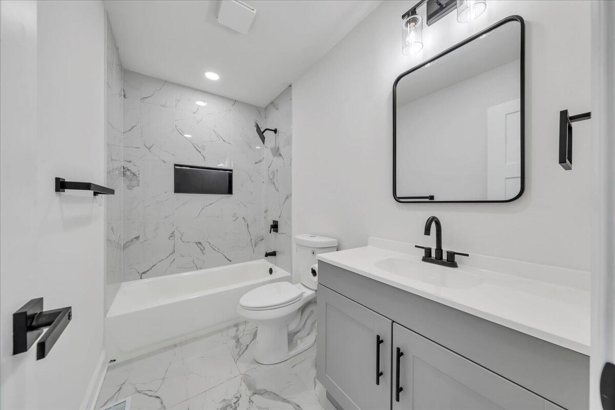 2365 Lakewood Forest Road Moneta, VA 24121 - Photo 29 of 90 a bathroom with a sink a toilet and bathtub