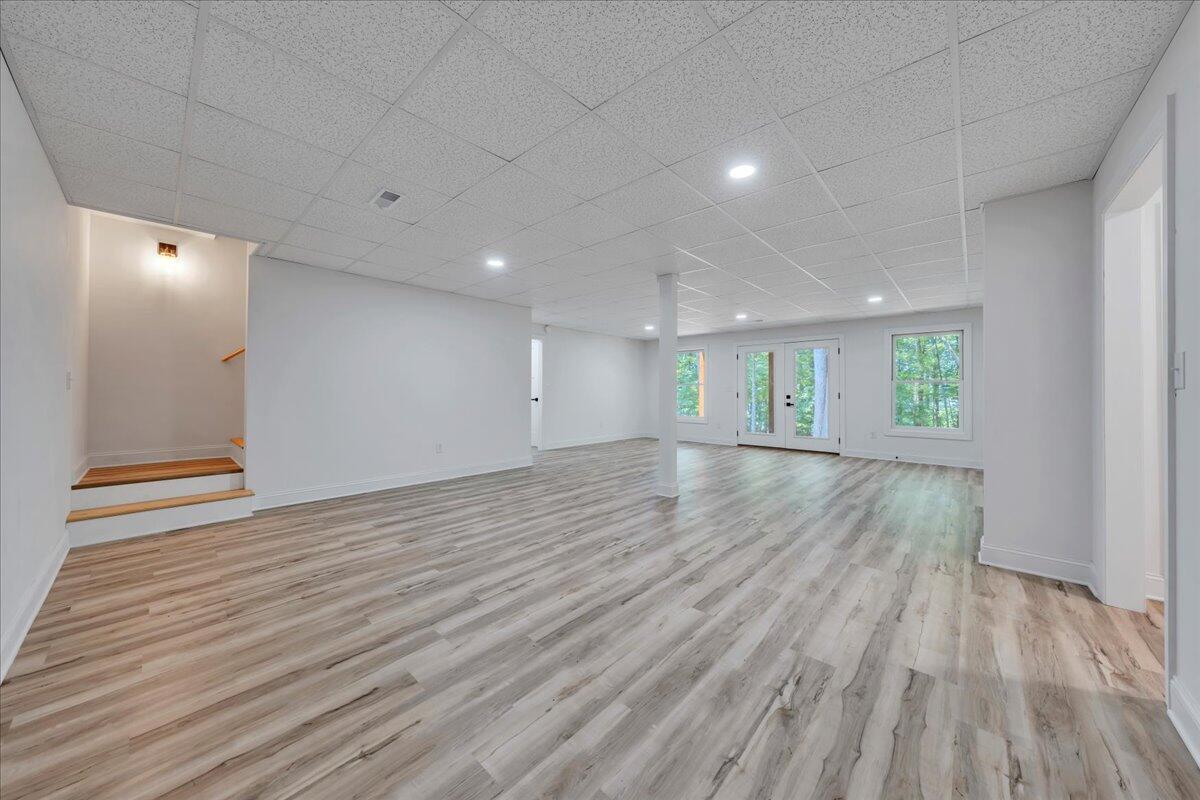 2365 Lakewood Forest Road Moneta, VA 24121 - Photo 30 of 90 an empty room with wooden floor and windows