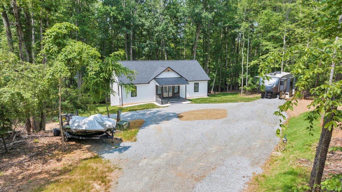 2365 Lakewood Forest Road Moneta, VA 24121 - Photo 56 of 90 a house with swimming pool in front of it
