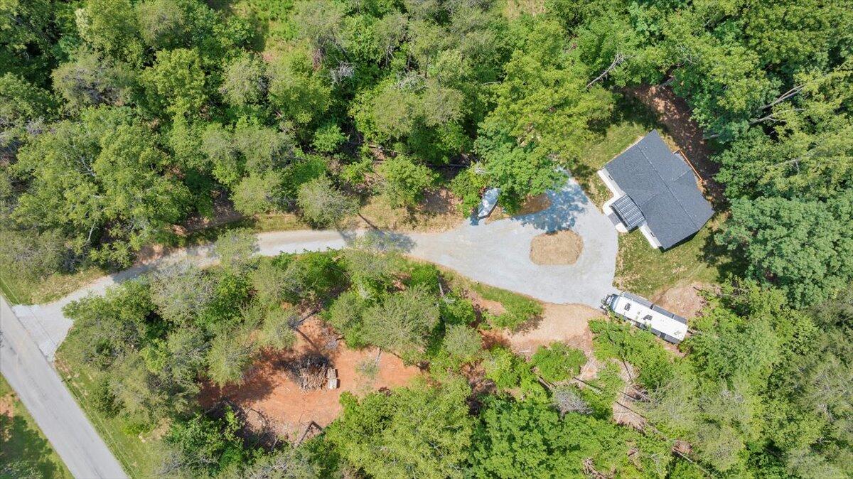 2365 Lakewood Forest Road Moneta, VA 24121 - Photo 58 of 90 an aerial view of a house with a yard and covered with green space