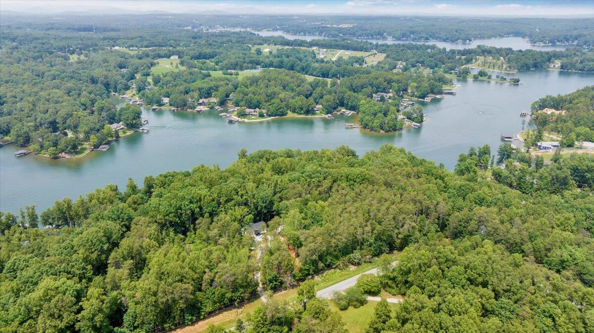 2365 Lakewood Forest Road Moneta, VA 24121 - Photo 62 of 90 an aerial view of residential houses with outdoor space and lake view