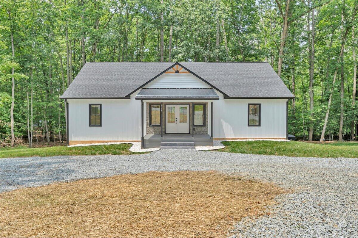 2365 Lakewood Forest Road Moneta, VA 24121 - Photo 84 of 90 a front view of a house with a yard and trees
