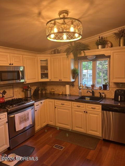 39 Hibiscus Place, Unit A Jackson, NJ 08527 - Photo 18 of 38 a kitchen with stainless steel appliances a stove a sink and a microwave