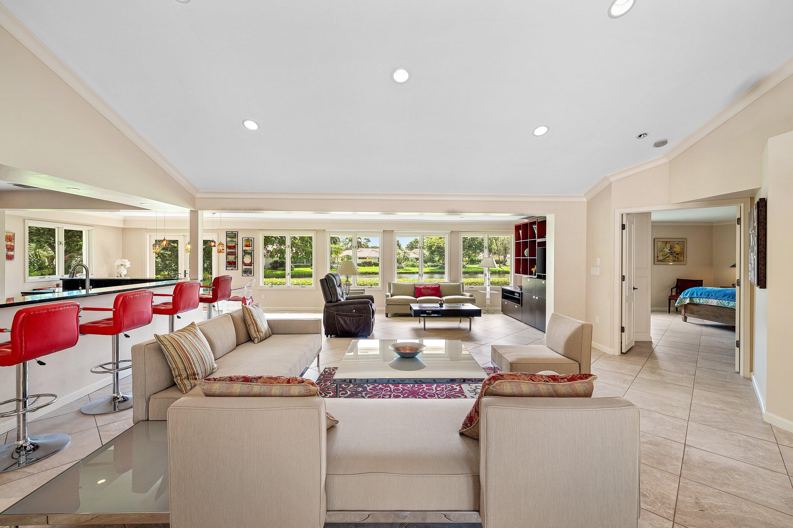 4365 Shell Drake Lane Boynton Beach, FL 33436 - Photo 7 of 56 a living room with furniture and a large window