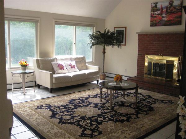 17 Aspen Road Sharon, MA 02067 - Photo 4 of 21 a living room with furniture and a fireplace