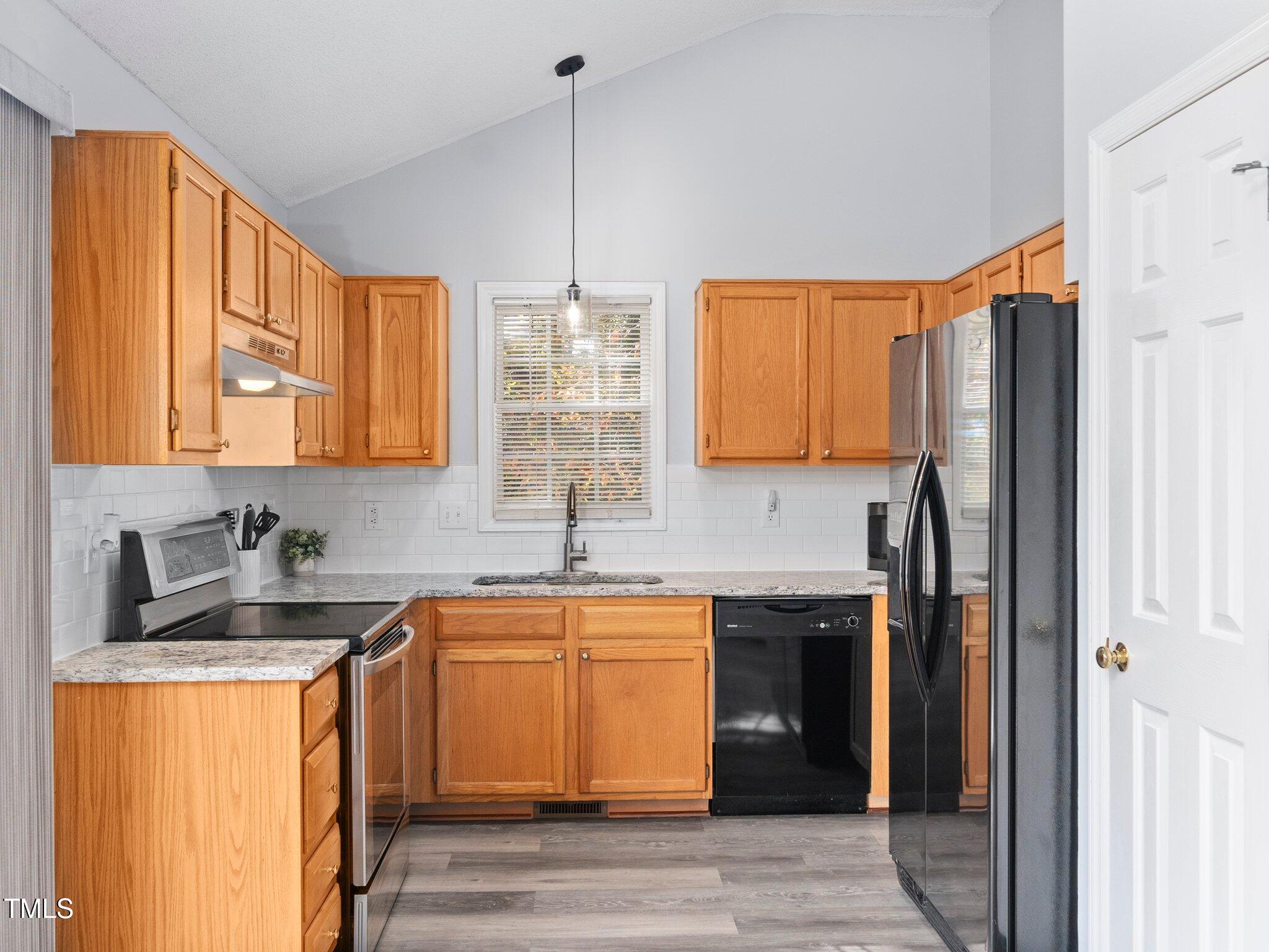 204 Rattan Bay Drive Raleigh, NC 27610 - Photo 9 of 28 Updated Kitchen with granite countertops