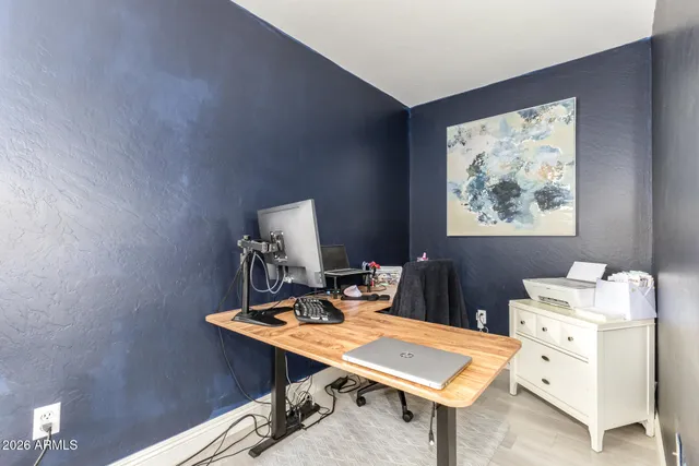 a view of a workspace with furniture