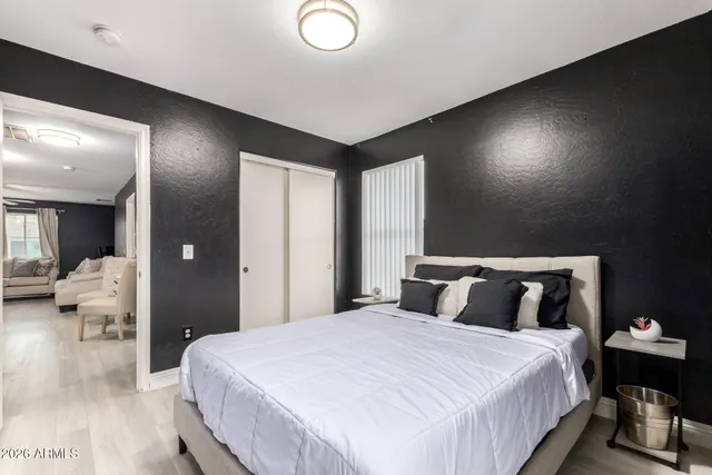 a bathroom with a sink a toilet a mirror and shower curtain