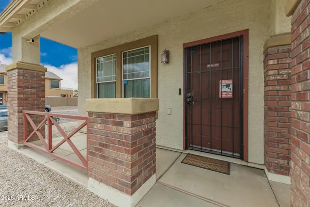 a view of front door of house and outdoor space