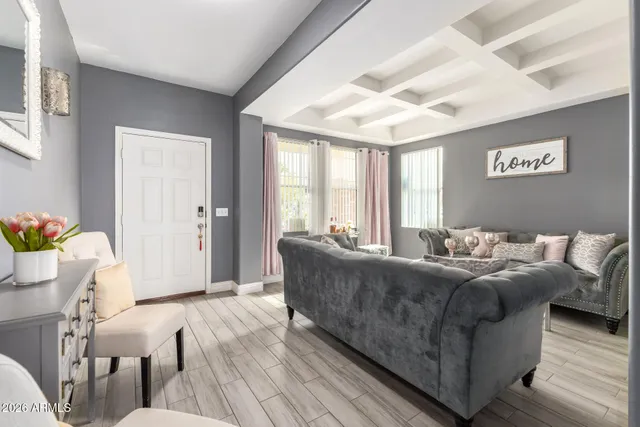 a living room with furniture and a large window