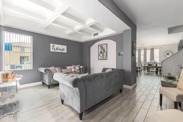 a living room with furniture and a table