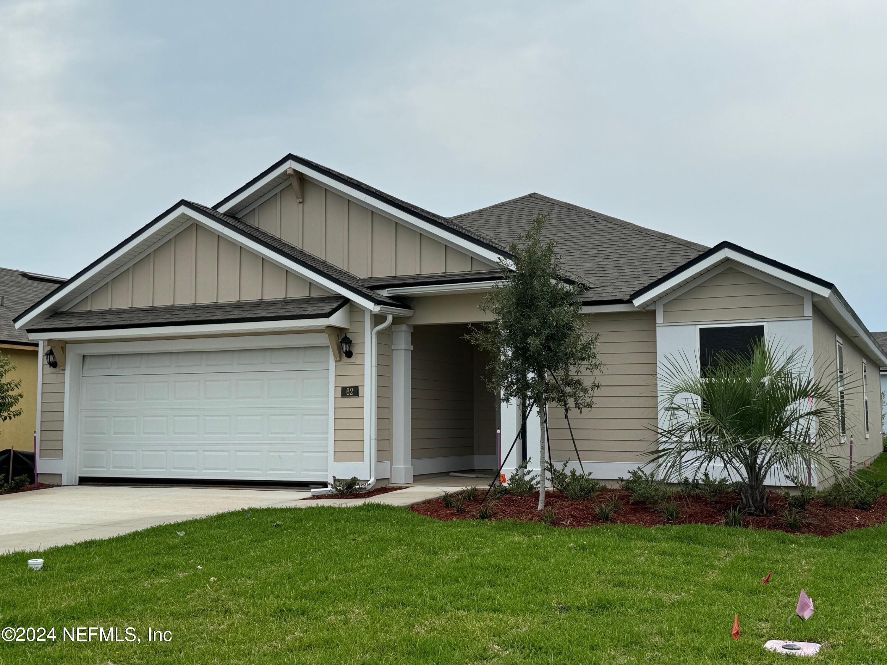 62 Hulett Wds Road Palm Coast, FL 32137 - Photo 1 of 22 front