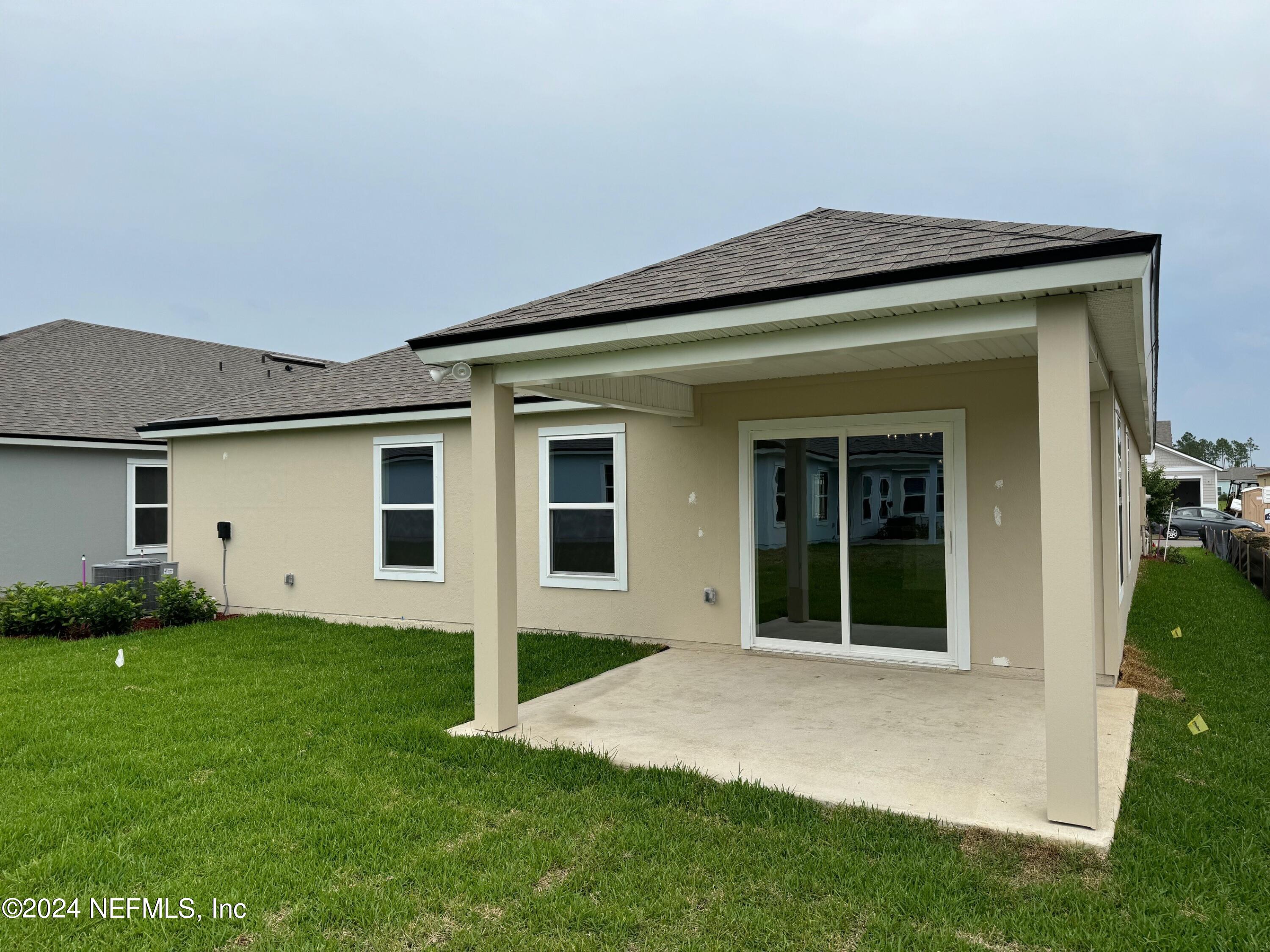 62 Hulett Wds Road Palm Coast, FL 32137 - Photo 9 of 22 rear