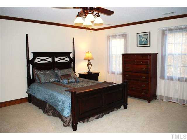 12325 Whartons Way Raleigh, NC 27613 - Photo 16 of 25 Master suite is sweet with dental molding, new carpeting, and ceiling fan. Layout of room is perfect for master furniture placement with two bright windows bringing light to this spacious retreat. Master Suite