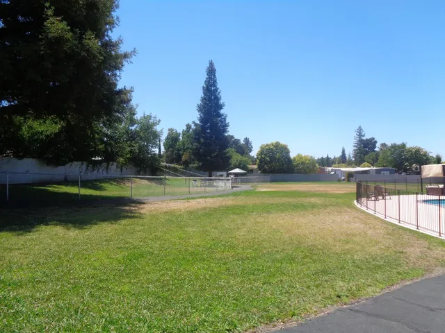 a view of a swimming pool with an outdoor space and seating area