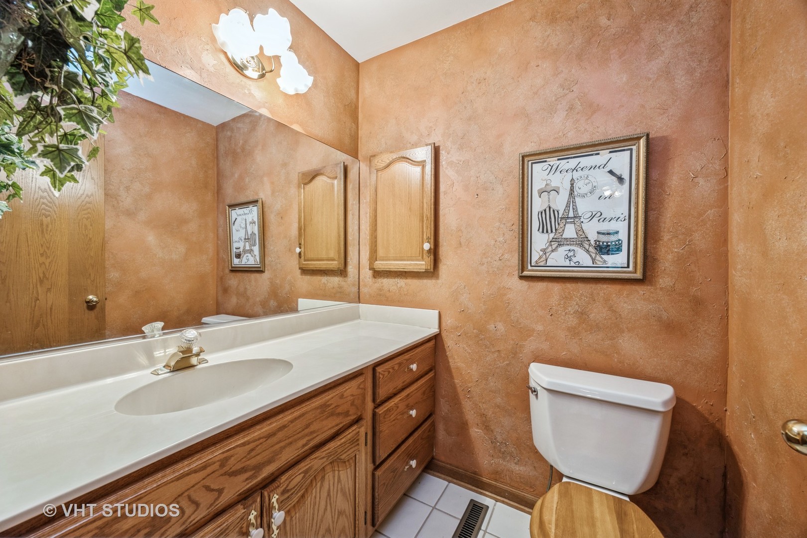 229 Shea Drive Flossmoor, IL 60422 - Photo 11 of 25 a bathroom with a sink a toilet and mirror