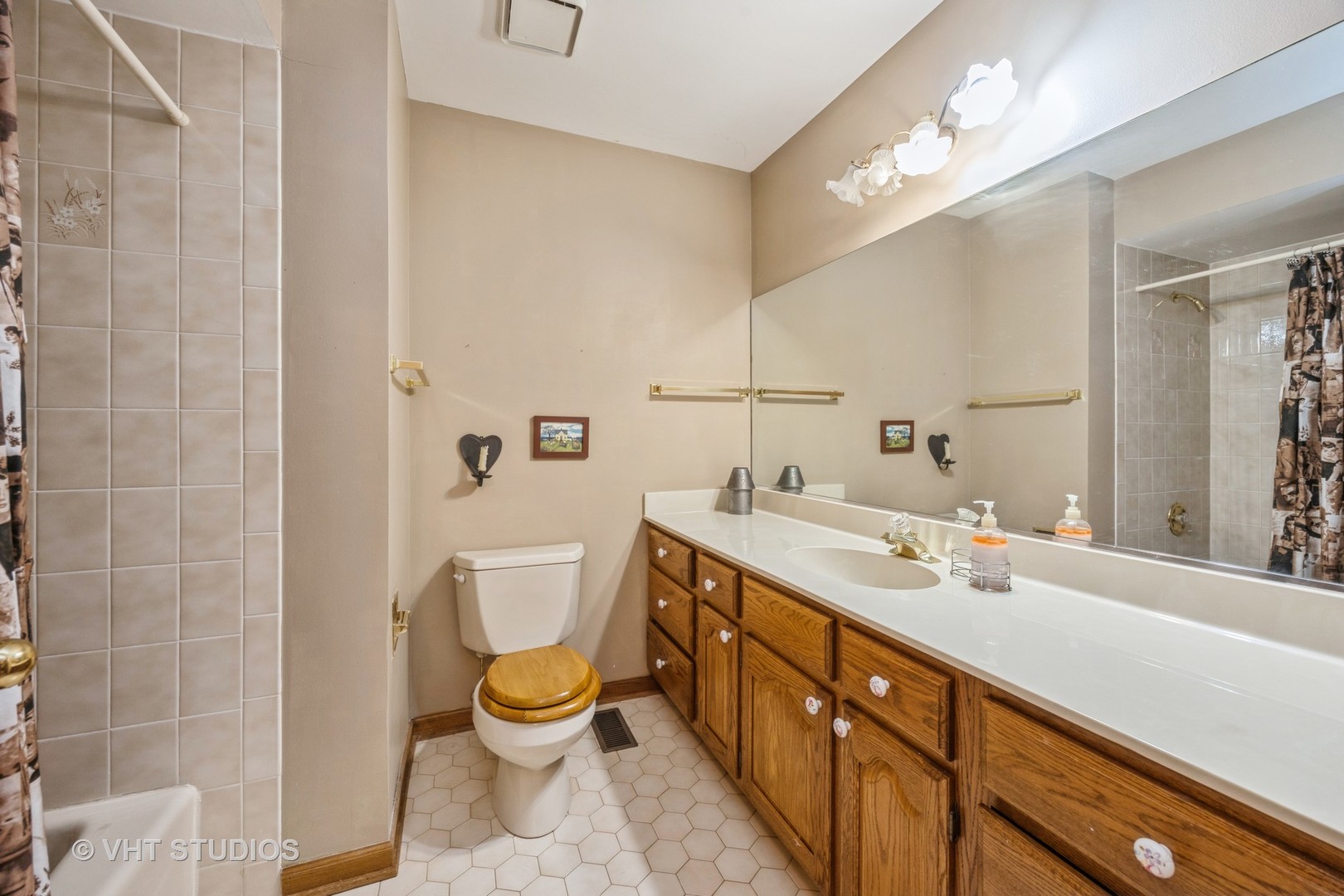 229 Shea Drive Flossmoor, IL 60422 - Photo 16 of 25 a bathroom with a double vanity sink toilet and a mirror