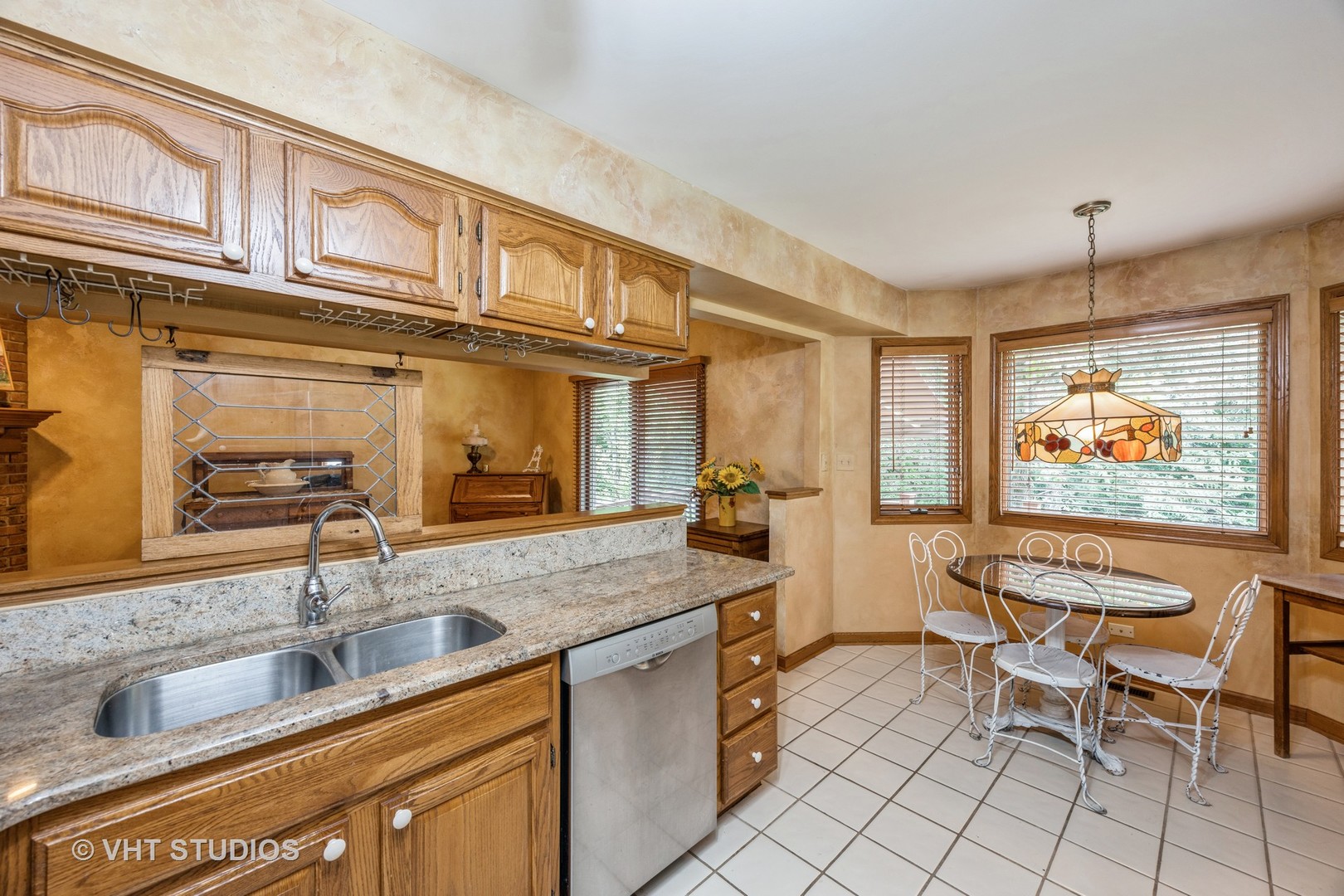 229 Shea Drive Flossmoor, IL 60422 - Photo 4 of 25 a kitchen with stainless steel appliances granite countertop a sink and a refrigerator