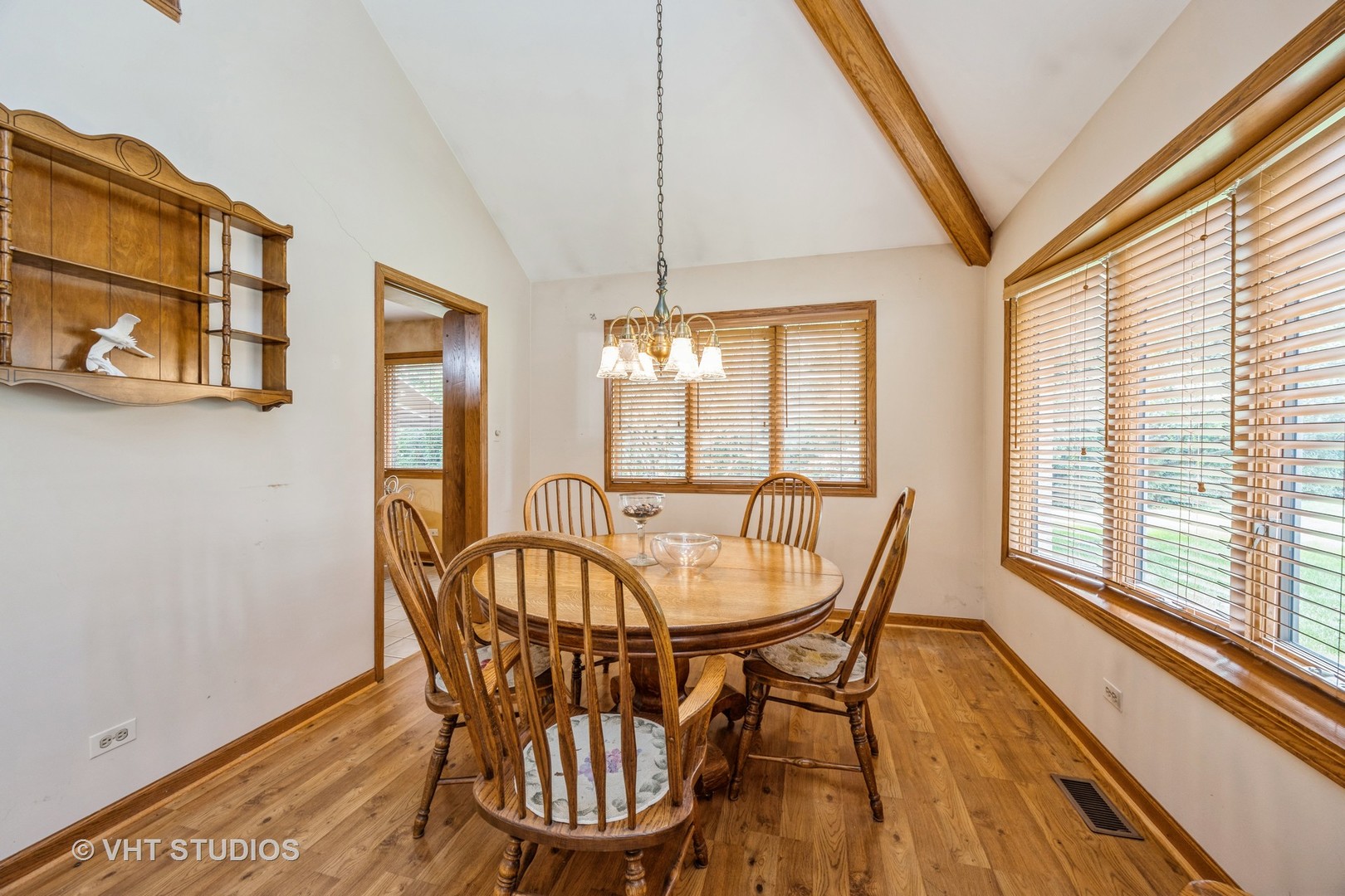 229 Shea Drive Flossmoor, IL 60422 - Photo 9 of 25 a dining room with furniture a chandelier and wooden floor