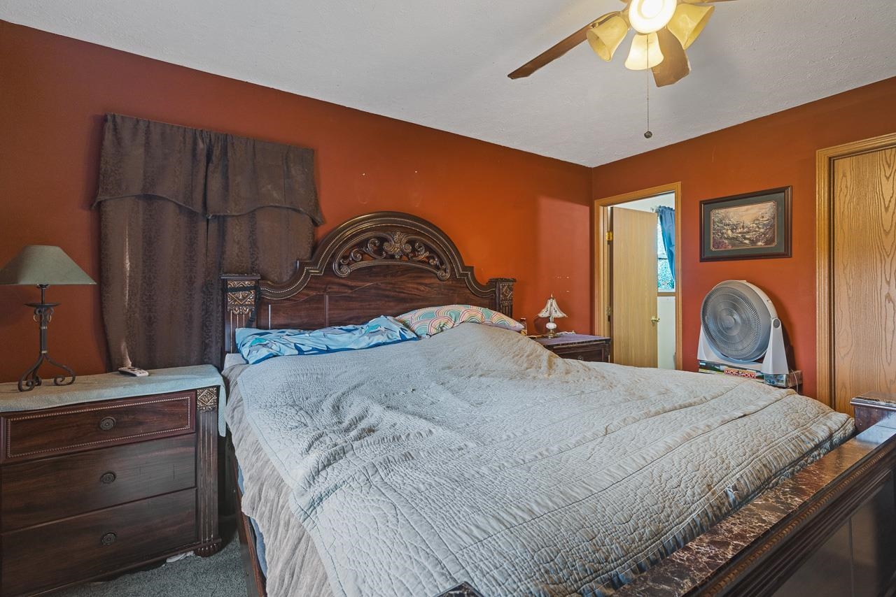175 Harvest Moon Trail Capron, IL 61012 - Photo 12 of 27 a bedroom with a bed and a dresser