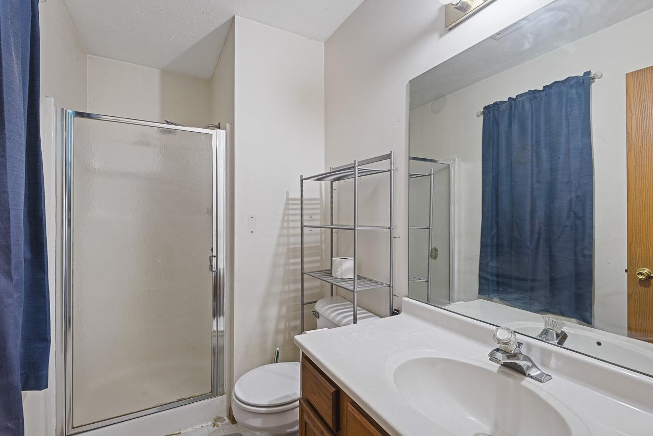 175 Harvest Moon Trail Capron, IL 61012 - Photo 13 of 27 a bathroom with a sink toilet and shower