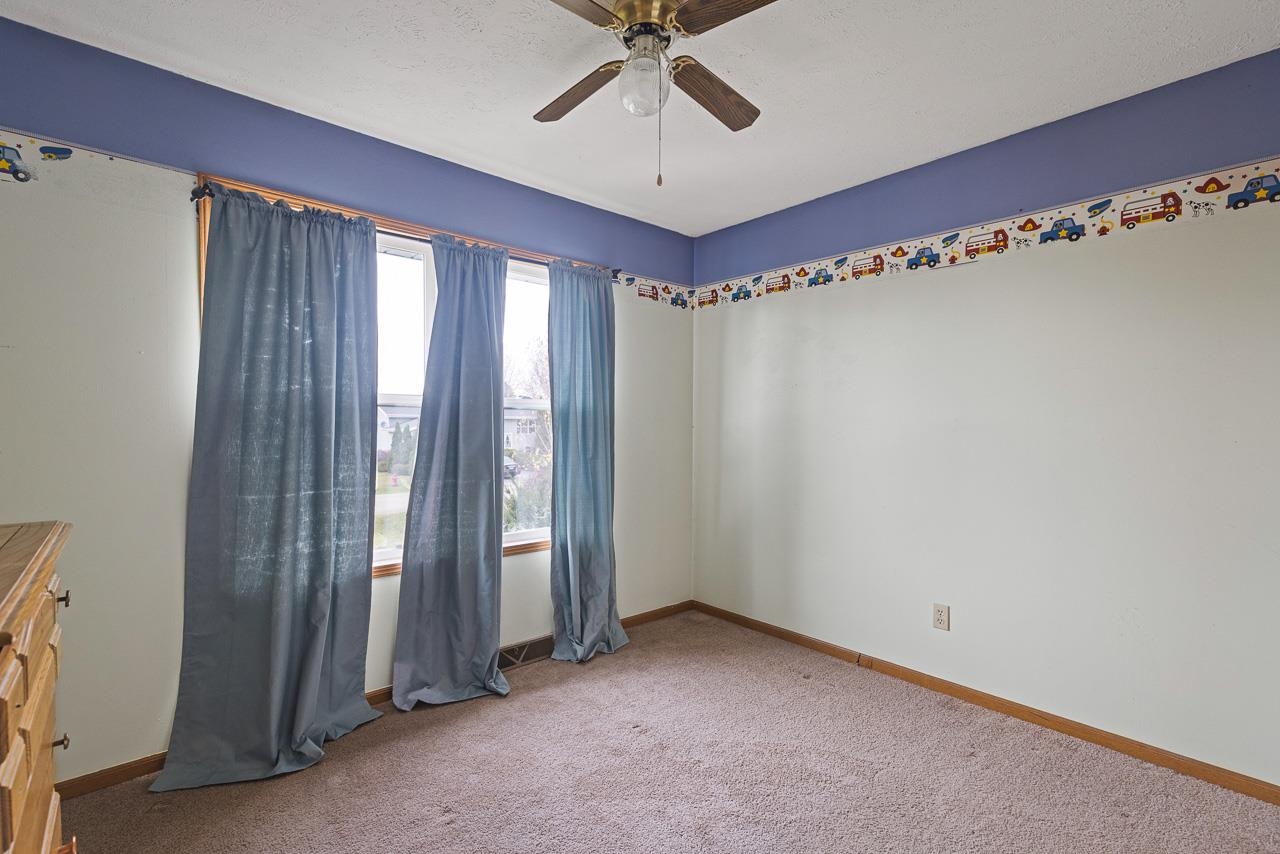 175 Harvest Moon Trail Capron, IL 61012 - Photo 14 of 27 a view of a room with window and a ceiling fan