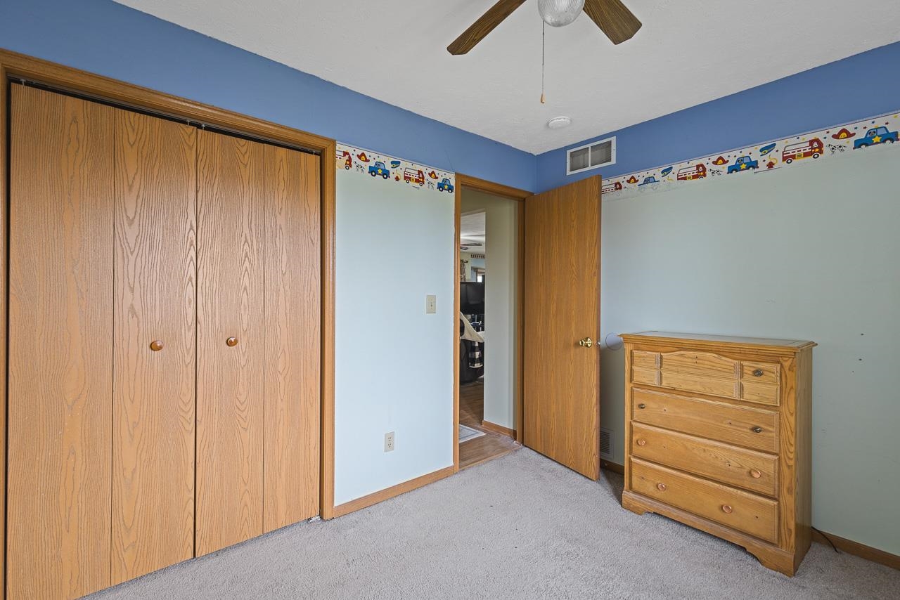 175 Harvest Moon Trail Capron, IL 61012 - Photo 15 of 27 a view of walk in closet with hardwood