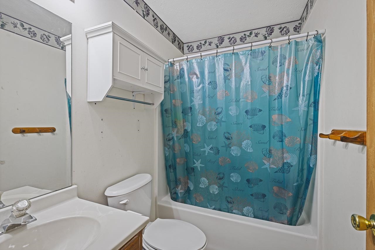 175 Harvest Moon Trail Capron, IL 61012 - Photo 18 of 27 a bathroom with a sink and a mirror