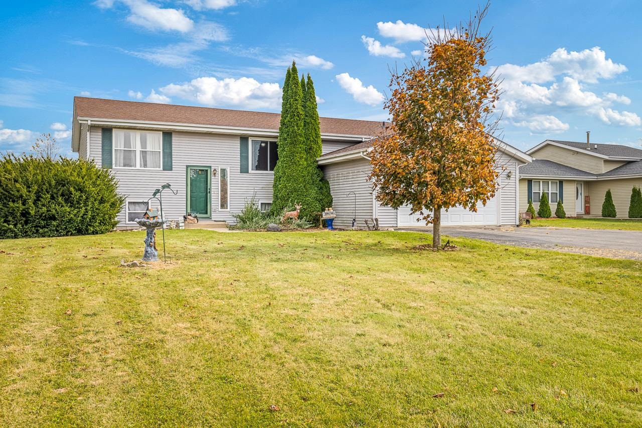 175 Harvest Moon Trail Capron, IL 61012 - Photo 2 of 27 a swimming pool with outdoor seating and yard