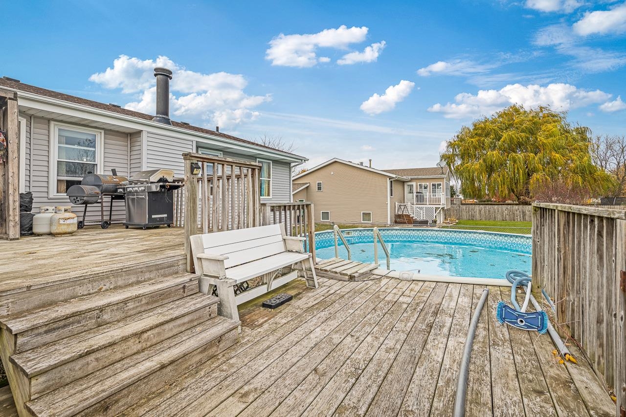 175 Harvest Moon Trail Capron, IL 61012 - Photo 25 of 27 a swimming pool with barbeque oven outdoor seating