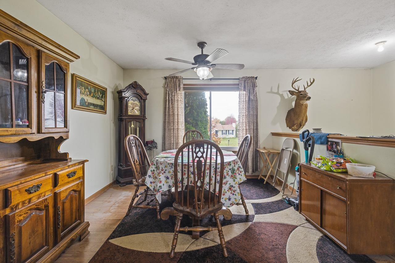 175 Harvest Moon Trail Capron, IL 61012 - Photo 6 of 27 a view of a dining room with furniture window and wooden floor