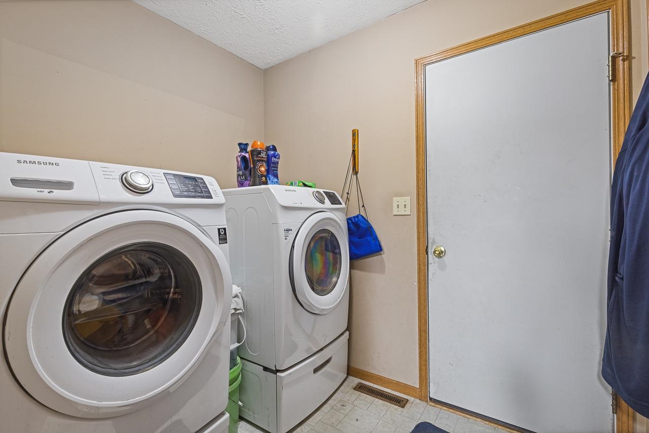 175 Harvest Moon Trail Capron, IL 61012 - Photo 10 of 27 a utility room with dryer and washer